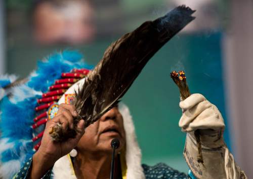 Lennie Mahler  |  The Salt Lake Tribune

Larry Cesspooch of the Ute Tribe leads a prayer in the opening plenary at the 2015 Parliament of the World's Religions held inside the Salt Palace Convention Center on Thursday, Oct. 15, 2015, in Salt Lake City.