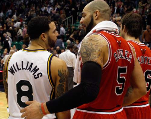 Tribune file photo

Deron Williams gives Carlos Boozer a hug after the Jazz were defeated by the Bulls, in Salt Lake City, Wednesday, February 9, 2011. It was the first game back in Salt Lake City for Boozer and Kyle Korver after they left to join the Bulls. The game was also Jerry Sloan's last game as head coach.