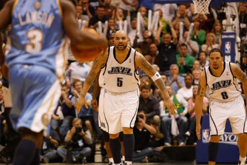 Tribune file photo

Utah Jazz's Carlos Boozer (5) and Utah Jazz's Deron Williams (8) keep an eye on Denver Nuggets' Ty Lawson (3) in the second half as the Jazz face the Nuggets during in the third game of the first round playoff series at EnergySolutions Arena in 2010.