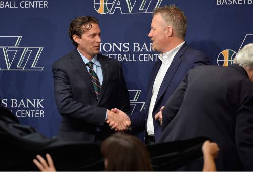 Tribune File Photo

Quinn Snyder shakes hands with Jazz CEO Greg Miler at the end of the press conference that introduced Snyder as their new head coach, Saturday, June 7, 2014.