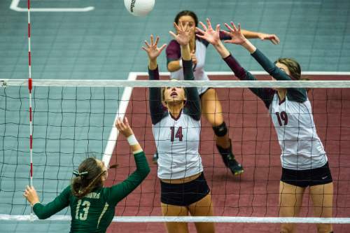 Chris Detrick  |  The Salt Lake Tribune
Morgan's Maddie Schenk (14) and Anna Cox (19) go up to block a spike from Snow Canyon's Alexsa Parker (13) during the 3A championship match at the UCCU Center Thursday October 29, 2015.