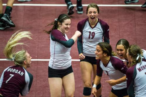 Chris Detrick  |  The Salt Lake Tribune
Members of the Morgan volleyball team celebrate winning a point during the 3A championship match at the UCCU Center Thursday October 29, 2015.