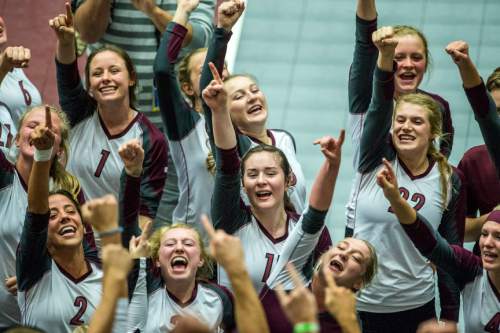 Chris Detrick  |  The Salt Lake Tribune
Members of the Morgan volleyball team celebrate after winning the 3A championship match 3-0 against Snow Canyon at the UCCU Center Thursday October 29, 2015.