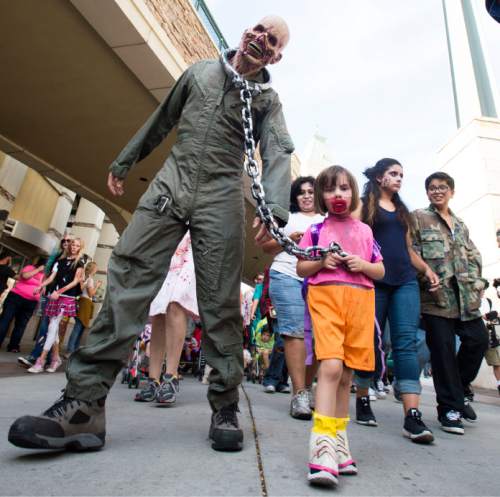 Steve Griffin  |  The Salt Lake Tribune
Zombies make their way through The Gateway in Salt Lake City, Sunday, Aug. 30, 2015 as Salt Lake Comic Con sponsored the 8th annual SLC Zombie Walk.