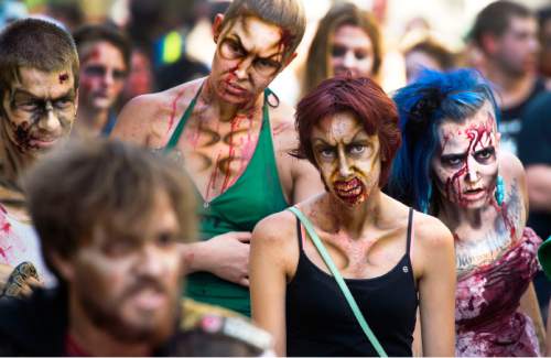 Steve Griffin  |  The Salt Lake Tribune

Zombies make their way through The Gateway in Salt Lake City, Sunday, Aug. 30, 2015 as Salt Lake Comic Con sponsored the 8th annual SLC Zombie Walk.
