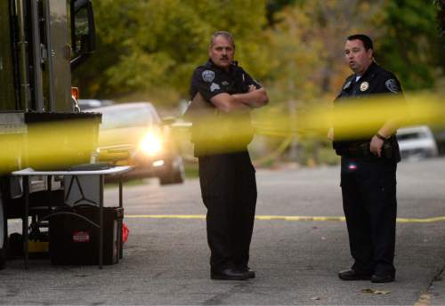 Al Hartmann  |  The Salt Lake Tribune
Scene of early morning double shooting-homicide Thursday Oct. 29 between a homeowner and assailant in Millcreek area of Salt Lake County.  Unified Police Dept. investigate the crime scene.