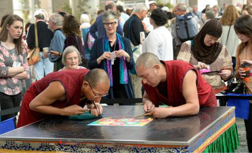 Al Hartmann  |  The Salt Lake Tribune
Buddhist monks from the Drepung Loseling Monastery create an intricate Mandala sand painting one grain of sand at a time at the Parliament of the World's Religions inside the Salt Palace Convention Center  Friday, Oct. 16 in Salt Lake City.  It takes monks 3-5 days to complete a Mandala.  An estimated 9500 people from 50 religions will attend the event from Oct. 15-19.
Diverse, religious female leaders share their collective wisdom for the empowerment of all and celebrate achievements within the interfaith movement.