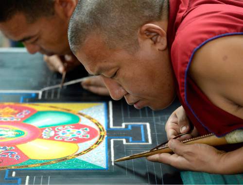 Al Hartmann  |  The Salt Lake Tribune
Buddhist monks from the Drepung Loseling Monastery create an intricate Mandala sand painting one grain of sand at a time at the Parliament of the World's Religions inside the Salt Palace Convention Center  Friday, Oct. 16 in Salt Lake City.  It takes monks 3-5 days to complete a Mandala.  An estimated 9500 people from 50 religions will attend the event from Oct. 15-19.
Diverse, religious female leaders share their collective wisdom for the empowerment of all and celebrate achievements within the interfaith movement.