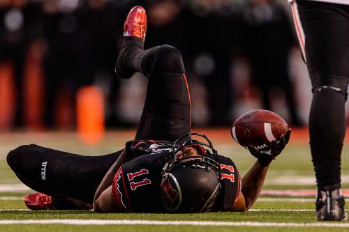 Trent Nelson  |  The Salt Lake Tribune
Utah Utes wide receiver Raelon Singleton (11) on the ground after a hard hit as the University of Utah hosts Oregon State, NCAA football at Rice-Eccles Stadium in Salt Lake City, Saturday October 31, 2015.