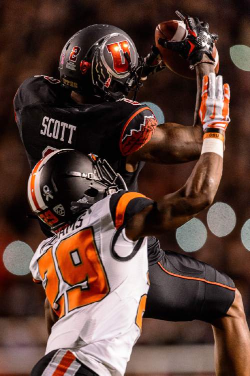 Trent Nelson  |  The Salt Lake Tribune
Utah Utes wide receiver Kenneth Scott (2) pulls in a pass over Oregon State Beavers cornerback Dwayne Williams (29) as the University of Utah hosts Oregon State, NCAA football at Rice-Eccles Stadium in Salt Lake City, Saturday October 31, 2015.