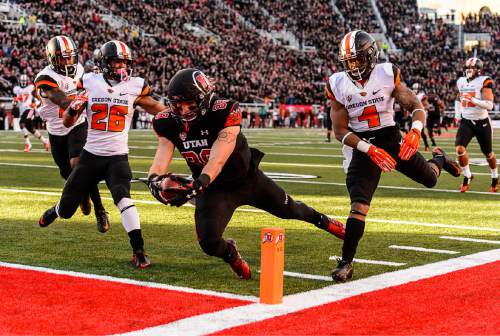 Trent Nelson  |  The Salt Lake Tribune
Utah Utes tight end Harrison Handley (88) dives into the end zone for a first quarter touchdown as the University of Utah hosts Oregon State, NCAA football at Rice-Eccles Stadium in Salt Lake City, Saturday October 31, 2015.