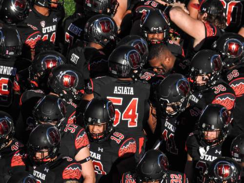 Trent Nelson  |  The Salt Lake Tribune
Utah players gather in a huddle as the University of Utah prepares to face Oregon State, NCAA football at Rice-Eccles Stadium in Salt Lake City, Saturday October 31, 2015.