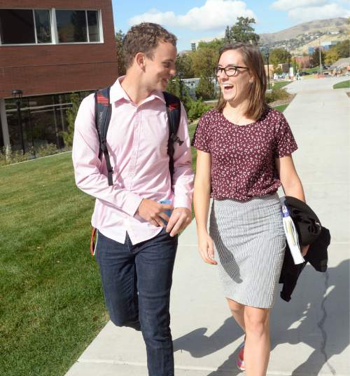 Al Hartmann  |  The Salt Lake Tribune
Sophomore Collin Hopkins walks with friend Senior Meg Garfield to class at the LDS Institute on the campus of the University of Utah.  He served a mission in Paraguay and she served a mission in Honduras.  Recently returned LDS missionaries now students at the University of Utah think that their life experiences in the mission field have helped their academic performance compared to their younger classmates.