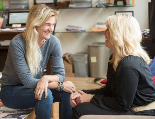 Rick Egan  |  The Salt Lake Tribune

Ann Marie Wallace (right)  gives some advice to  to Abbey Daw (left), owner of Sweat & Soul Yoga, Thursday, October 29, 2015. Ann Marie Wallace coaches women entrepreneurs on how to start and grow their businesses.
