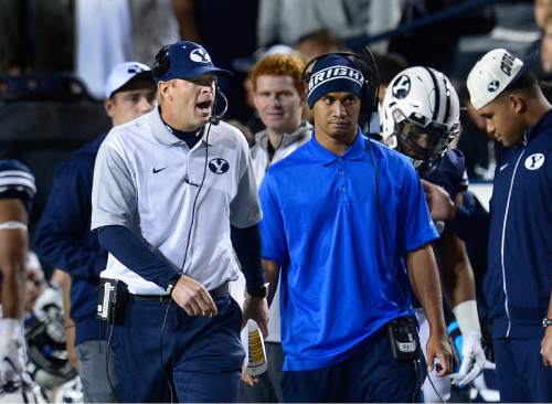 Scott Sommerdorf   |  The Salt Lake Tribune
BYU head coach Bronco Mendenhall barks instructions to his offense during first half play. UCONN and BYU were tied 7-7 at the half, October 2, 2015.