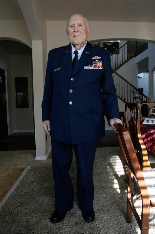 Scott Sommerdorf  |  The Salt Lake Tribune
          
Emmett "Cyclone" Davis poses in his Air Force uniform in his home in Highland, Thursday, December 6, 2012. Davis, a native of Roosevelt, was a young pilot in the Army Air Corps, based at Wheeler Field in Hawaii, when the Japanese attacked Pearl Harbor on Dec. 7, 1941. He was one of the few pilots able to get into the air in an attempt to defend Pearl Harbor. He is now 93 (94 this month) and lives in his own home with his wife, Majorie. His son, Tucker, is writing a biography of his father.