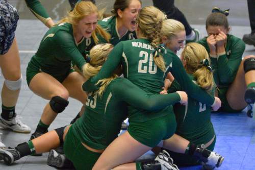 Chris Detrick  |  The Salt Lake Tribune
Members of the Snow Canyon volleyball team celebrate after winning the 3A state championship game at the UCCU Center at Utah Valley University Thursday October 30, 2014.