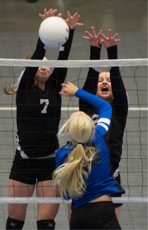 Rick Egan  |  The Salt Lake Tribune

Panguitch Bobcats Jordan Bennett (20)  hits the ball, as Monticello Buckaroos Allie Maughan (14) and Averi Christiansen (7) defend in prep 1A championship volleyball action Panguitch vs. Monticello, at Utah Valley University, Saturday, October 31, 2015.