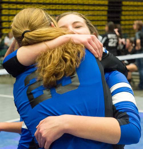 Rick Egan  |  The Salt Lake Tribune

Panguitch Bobcats Chesney Campbell  (23) and Makayla Daton (5), celebrate their State Championship win over Monticello, in prep 1A volleyball championship at Utah Valley University, Saturday, October 31, 2015.