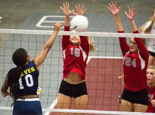 Rick Egan  |  The Salt Lake Tribune

Enterprise Wolves Jaslyn Gardner (10)  hits the ball as The Delta Rabbits Delta Rabbits Rylie Church (16) and Kaylee Leavitt (24) defend, in the prep 2A State Volleyball Championship game at Utah Valley University, Saturday, October 31, 2015.