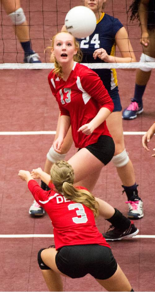 Rick Egan  |  The Salt Lake Tribune

Delta Rabbits Tatum Stanworth (13) looks on as Delta Rabbits  Kassie Albrecht (3) hits the ball, in the prep 2A State Volleyball Championship game at Utah Valley University, Saturday, October 31, 2015.