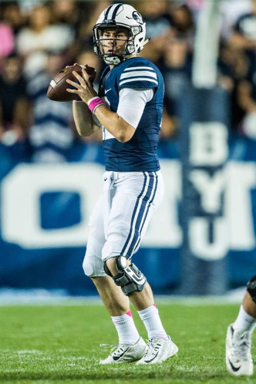 Chris Detrick  |  The Salt Lake Tribune
Brigham Young Cougars quarterback Tanner Mangum (12) looks to pass the ball during the game at LaVell Edwards Stadium Friday October 16, 2015.