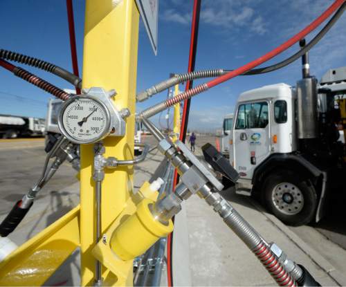 Al Hartmann  |  The Salt Lake Tribune
Sanitation truck fills up at Salt Lake County Fleet Management's new CNG (compressed natural gas) filling station Tuesday Nov. 3.  The new CNG filling stations will service its large fleet of trucks that are switiching from diesel to the cleaner, cheaper charged natural gas. The change to this fuel is expected to reduce the fleet's contribution to  air pollution in the Salt Lake Valley ó just as residents brace for on the onset of inversion season.