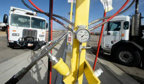 Al Hartmann  |  The Salt Lake Tribune
Sanitation trucks fill up at Salt Lake County Fleet Management's new CNG (compressed natural gas) filling station Tuesday Nov. 3.  The new CNG filling stations will service its large fleet of trucks that are switiching from diesel to the cleaner, cheaper charged natural gas. The change to this fuel is expected to reduce the fleet's contribution to  air pollution in the Salt Lake Valley -- just as residents brace for on the onset of inversion season.