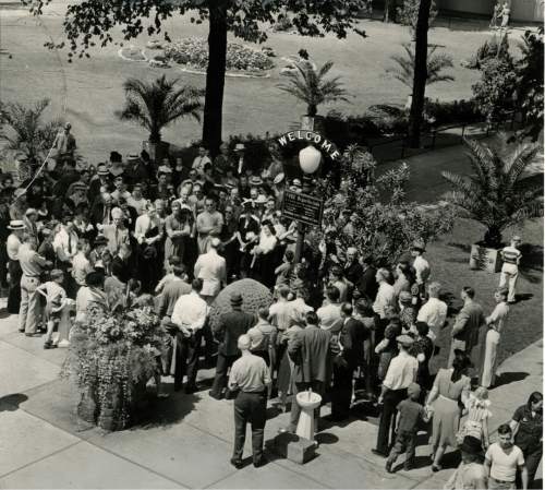 Tribune file photo

Tourists gather around a sign advertising free organ concerts on Temple Square in this undated photo.