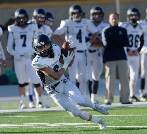 Steve Griffin  |  The Salt Lake Tribune

Corner Canyon receiver Nate Cutler heads upfield after catching a pass during the Class 4A quarterfinal football game between Corner Canyon and Highland at Highland High School in Salt Lake City, Friday, November 6, 2015.