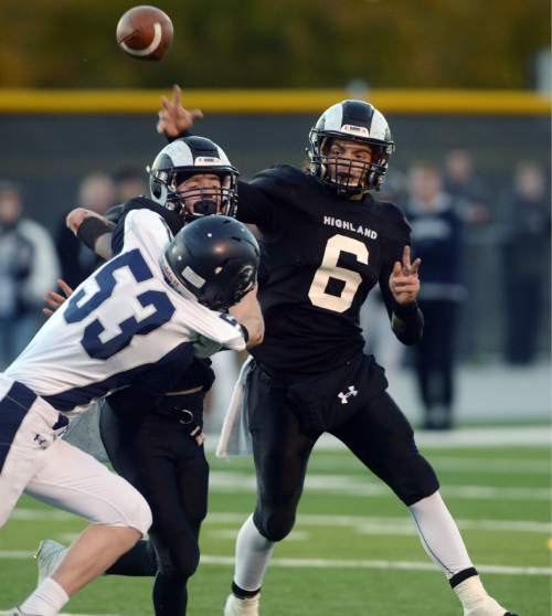 Steve Griffin  |  The Salt Lake Tribune

Highland quarterback James Pembroke fires a pass during the Class 4A quarterfinal football game between Corner Canyon and Highland at Highland High School in Salt Lake City, Friday, November 6, 2015.