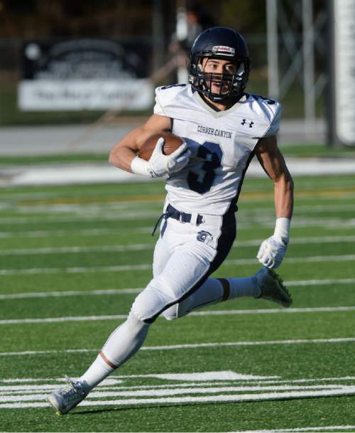 Steve Griffin  |  The Salt Lake Tribune

Corner Canyon's Nate Cutler sweeps around the end during the Class 4A quarterfinal football game between Corner Canyon and Highland at Highland High School in Salt Lake City, Friday, November 6, 2015.