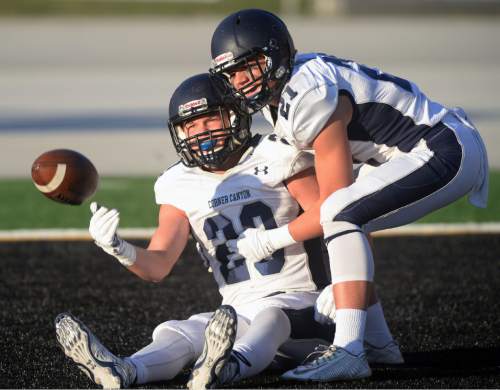 Steve Griffin  |  The Salt Lake Tribune

Corner Canyon receiver Chase Meyer gets picked up out of the end zone by teammate Ryan Hansen after he was dragged down at the one-yard-line after long pass pley during the Class 4A quarterfinal football game at Highland High School in Salt Lake City, Friday, November 6, 2015.