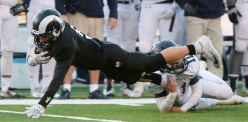 Steve Griffin  |  The Salt Lake Tribune

Highland receiver Ryan Lambson leaps for more yardage during the Class 4A quarterfinal football game between Corner Canyon and Highland at Highland High School in Salt Lake City, Friday, November 6, 2015.