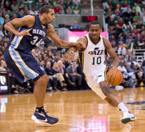 Lennie Mahler  |  The Salt Lake Tribune

Utah guard Alec Burks drives past Memphis center Brandan Wright in the first half of a game against the Memphis Grizzlies at Vivint Smart Home Arena on Saturday, Nov. 7, 2015.