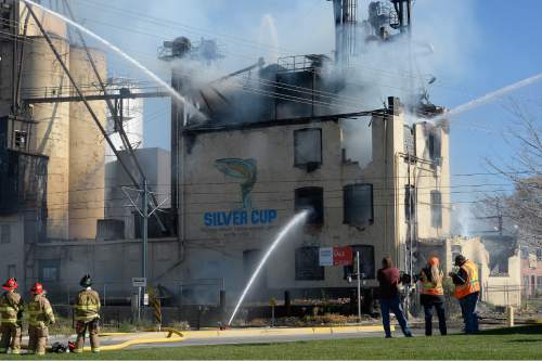 Scott Sommerdorf   |  The Salt Lake Tribune
Firefighters battle a two-alarm fire at the iconic Silver Cup fish feed factory in Murray, Saturday, November 7, 2015.