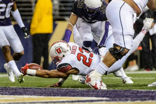 Trent Nelson  |  The Salt Lake Tribune
Utah Utes running back Devontae Booker (23) scores a touchdown as the University of Utah faces the University of Washington, NCAA football at Husky Stadium in Seattle, Saturday November 7, 2015.