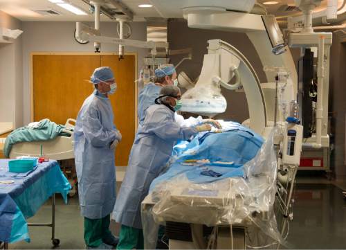 Rick Egan  |  The Salt Lake Tribune

Doctors perform a coronary angiogram on a patient in the Cardiac Catheterization Laboratory at Intermountain Medical Center Heart Institute, Friday, Nov. 6, 2015.