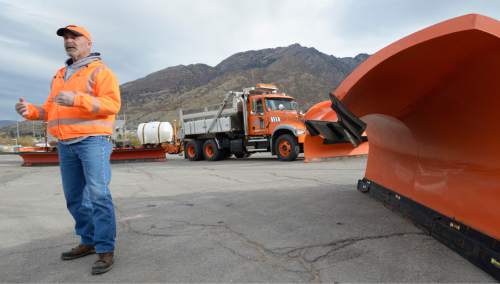 Al Hartmann  |  The Salt Lake Tribune
Utah Department of Transportation Roadway Operation Manager Ken Syme stands next to a double-wing blade snow plow that plows 2.5 road lanes at UDOT's Cottonwood Maintenence Station Monday Nov. 9.  The agency is gearing up for the first winter storms of the season.