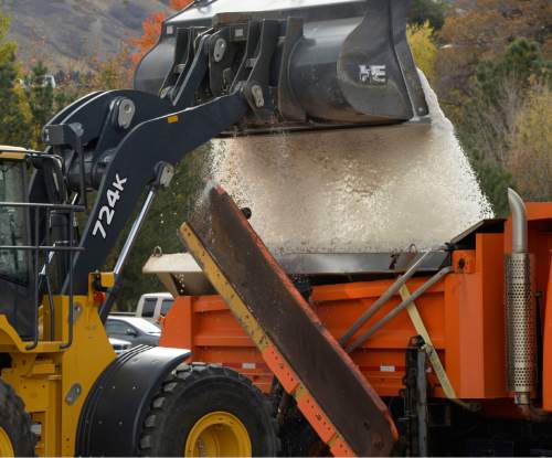 Al Hartmann  |  The Salt Lake Tribune
Front-end loader dumps 5 cubic feet of salt into truck bed for snow plow at UDOT's Cottonwood Maintenence Station Monday Nov. 10.  The plow holds 10 cubic feet.  The agency is gearing up for the first winter storms of the season.