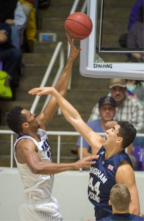 Rick Egan  |  The Salt Lake Tribune

Weber State Wildcats forward Joel Bolomboy (21) scores overBrigham Young Cougars center Corbin Kaufusi (44), in basketball action BYU vs Weber State, at the Dee Events Center in Ogden, Saturday, December 13, 2014