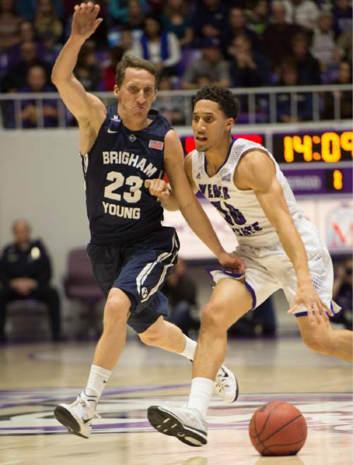 Rick Egan  |  The Salt Lake Tribune

Brigham Young Cougars guard Skyler Halford (23) tires to keep up with Weber State Wildcats guard Jeremy Senglin (30), in basketball action BYU vs Weber State, at the Dee Events Center in Ogden, Saturday, December 13, 2014