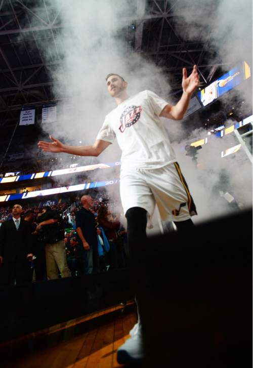 Steve Griffin  |  The Salt Lake Tribune

Utah Jazz forward Gordon Hayward (20) walks through a smoke screen as he is introduced during the home opener for the Utah Jazz as they play the Portland Trailblazers NBA basketball game at Vivint Smart Home Arena in Salt Lake City, Wednesday, November 4, 2015.