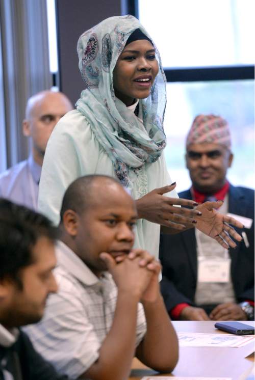 Al Hartmann  |  The Salt Lake Tribune
Refugee leader Jawaher Fadhel speaks to Gov. Gary Herbert and officials in a roundtable meeting with area refugees at the new Utah Refugee Education and Training Center at Salt Lake Communty College Medowbrook Campus Tuesday Nov 10.