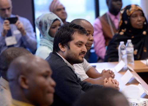 Al Hartmann  |  The Salt Lake Tribune
Refugee leaders listen as in a roundtable meeting with Gov. Gary Herbert at the new Utah Refugee Education and Training Center at Salt Lake Communty College Medowbrook Campus Tuesday Nov 10.