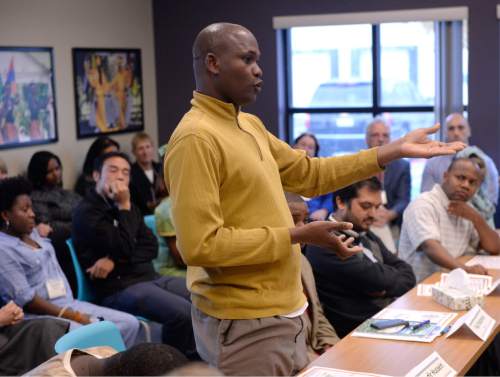 Al Hartmann  |  The Salt Lake Tribune
Refugee Leader Abdikadir Hussein speaks to Gov. Gary Herbert and officials in a roundtable meeting with area refugees at the new Utah Refugee Education and Training Center at Salt Lake Communty College Medowbrook Campus Tuesday Nov 10.