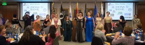 Steve Griffin  |  The Salt Lake Tribune

Women veterans stand after modeling gowns media specially for them during the "Grit to Glamour" fashion show at the Zions Bank offices in Salt Lake City, Tuesday, November 10, 2015.  As part of the evening women military veterans traded camouflage and boots as they modeled gowns and heels.