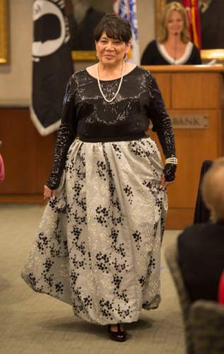 Steve Griffin  |  The Salt Lake Tribune

Rose Martinez, who was a staff seargan in the Army, models her gown during the "Grit to Glamour" fashion show at the Zions Bank offices in Salt Lake City, Tuesday, November 10, 2015.  As part of the evening women military veterans traded camouflage and boots as they modeled gowns and heels.