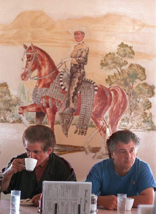 Rick Egan  |  Tribune File Photo

Bill looms in the back ground as Louie and his brother John Bablos eat breakfast at Bill and Nada's, Aug. 6, 1999.