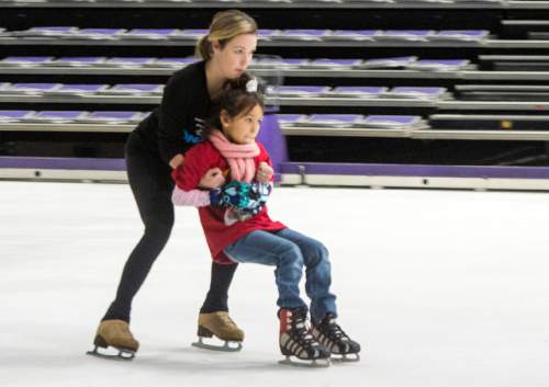 Rick Egan  |  The Salt Lake Tribune

Kasey Miranda, 6, skates with Elena Ban Aert, children from local charities skated with cast members of Disney on Ice's "Dare to Dream" show, at Vivint Smart Home Arena, Thursday, November 12, 2015.